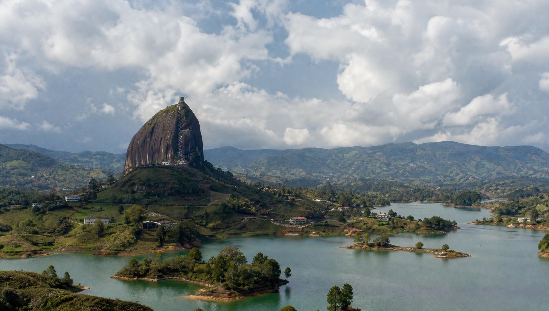 El Peñón de Guatapé rising above the emerald reservoir and green islands