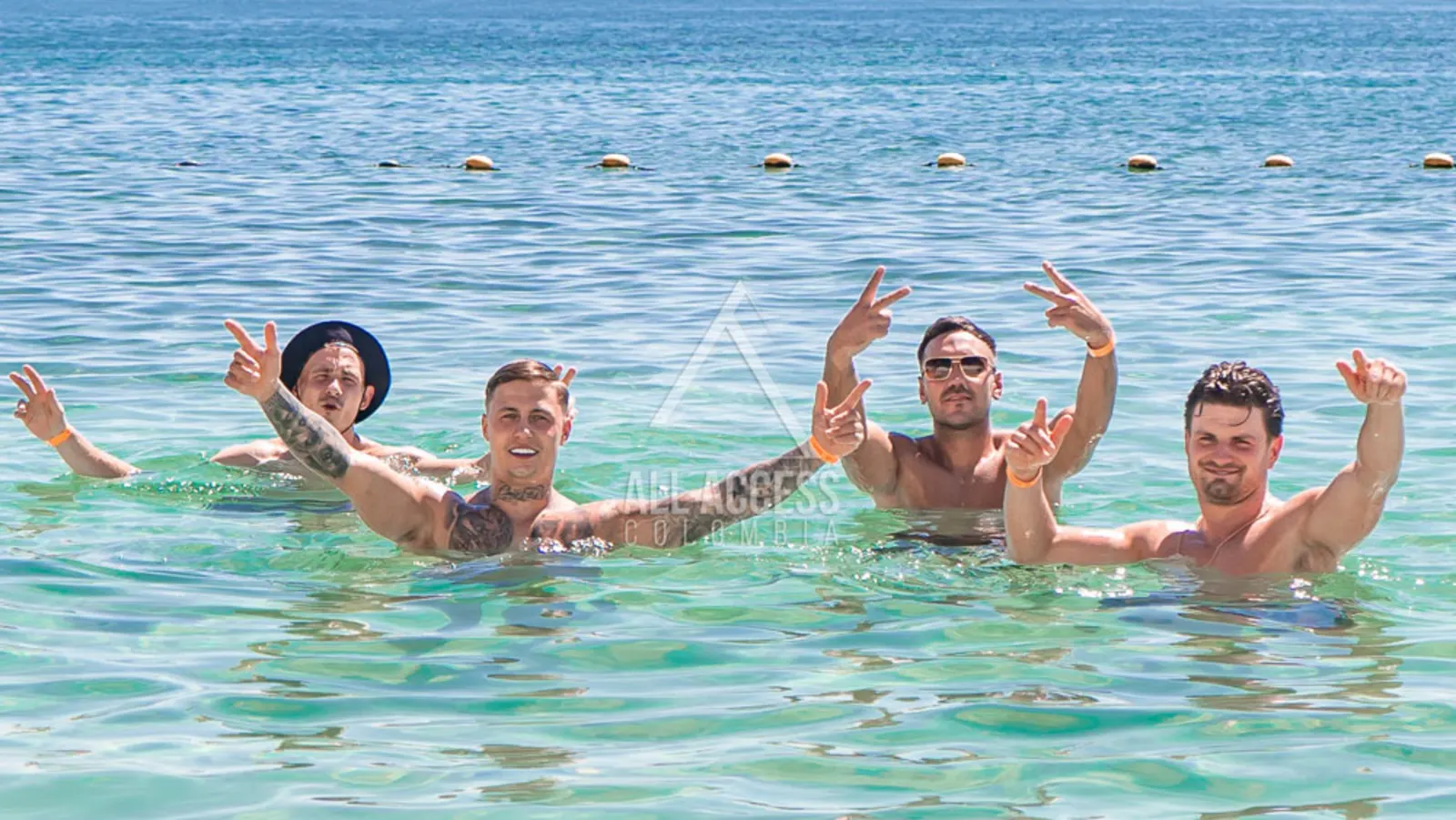 Guests swimming off a private island in the Rosarios