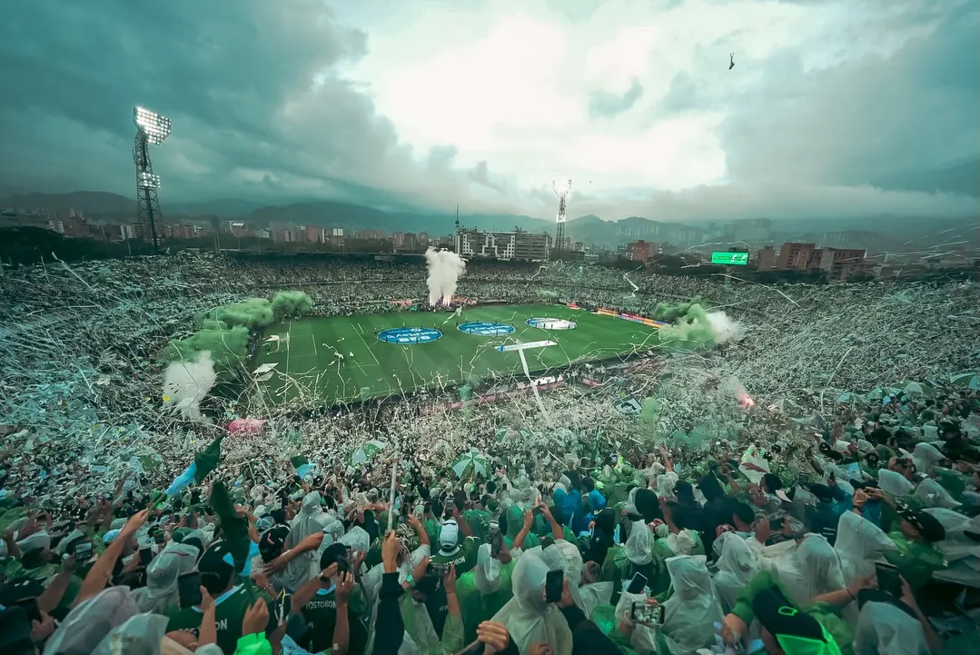 Packed football stadium in Colombia under floodlights